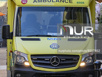 Yellow ambulance, an emergency service vehicle with paramedics of the National Health Service NHS parked on the streets of the British capit...