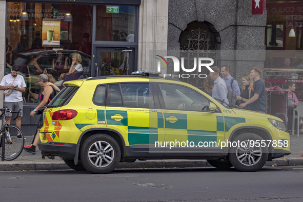 Yellow ambulance, an emergency service vehicle with paramedics of the National Health Service NHS parked on the streets of the British capit...