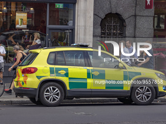 Yellow ambulance, an emergency service vehicle with paramedics of the National Health Service NHS parked on the streets of the British capit...