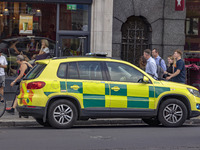 Yellow ambulance, an emergency service vehicle with paramedics of the National Health Service NHS parked on the streets of the British capit...