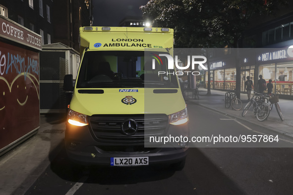 Yellow ambulance, an emergency service vehicle with paramedics of the National Health Service NHS parked on the streets of the British capit...