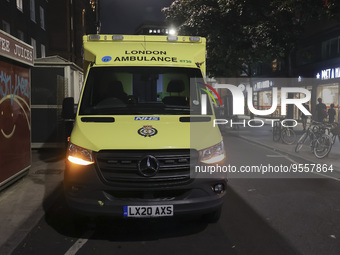 Yellow ambulance, an emergency service vehicle with paramedics of the National Health Service NHS parked on the streets of the British capit...