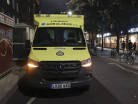 Yellow ambulance, an emergency service vehicle with paramedics of the National Health Service NHS parked on the streets of the British capit...