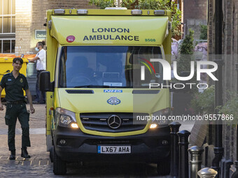 Yellow ambulance, an emergency service vehicle with paramedics of the National Health Service NHS parked on the streets of the British capit...