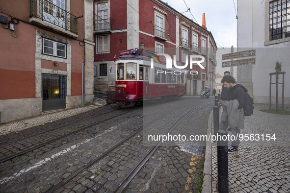 A tram is seen traveling through one of the streets of the Graca district. Lisbon, January 23, 2023.  In Portugal, the transmissibility inde...