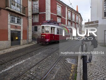 A tram is seen traveling through one of the streets of the Graca district. Lisbon, January 23, 2023.  In Portugal, the transmissibility inde...