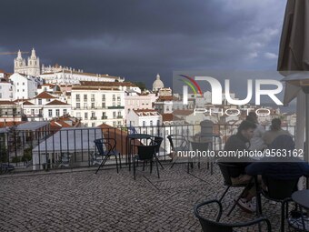 Several people are seen touring a viewpoint located in the Santa Apolonia neighborhood. Lisbon, January 16, 2023. In Portugal, the transmiss...