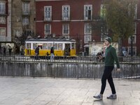 A man is seen walking along one of the viewpoints located in the historic district of Graca. Lisbon, January 23, 2023. In Portugal, the tran...