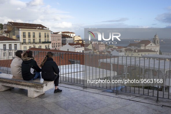 Several people are seen touring a viewpoint located in the Santa Apolonia neighborhood. Lisbon, January 16, 2023. In Portugal, the transmiss...