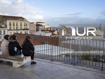 Several people are seen touring a viewpoint located in the Santa Apolonia neighborhood. Lisbon, January 16, 2023. In Portugal, the transmiss...