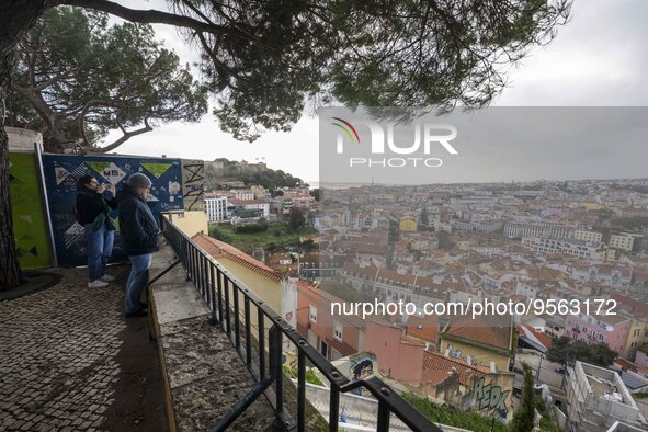 Several people are seen sitting at a viewpoint located in the Graca neighborhood. Lisbon, January 16, 2023. In Portugal, the transmissibilit...