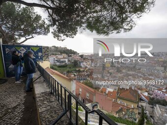 Several people are seen sitting at a viewpoint located in the Graca neighborhood. Lisbon, January 16, 2023. In Portugal, the transmissibilit...