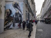 People are seen walking along one of the streets in the Baixa district. Lisbon, January 23, 2023. In Portugal, the transmissibility index (R...