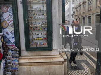 People using protective mask are seen walking along one of the streets in the Baixa district. Lisbon, January 23, 2023. In Portugal, the tra...