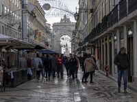 People are seen walking along one of the streets in the Baixa district. Lisbon, January 23, 2023. In Portugal, the transmissibility index (R...