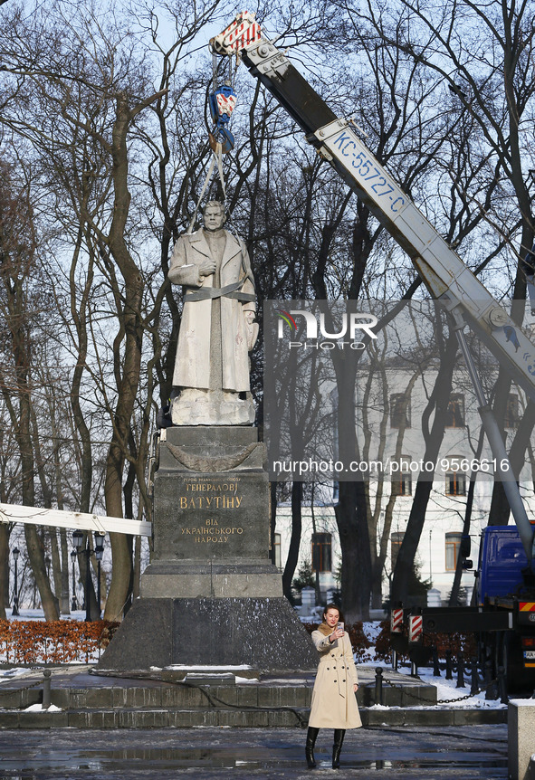 A woman takes a selfie in front of dismount a monument to WWII Soviet Army General Nikolai Vatutin in downtown in Kyiv, Ukraine 9 February 2...