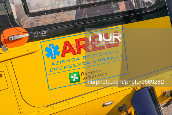 Logo AREU - Azienda Regionale Emergenza Urgenza printed on the side of medical helicopter, in Cernusco sul Naviglio, Italy, on February 10,...