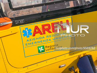 Logo AREU - Azienda Regionale Emergenza Urgenza printed on the side of medical helicopter, in Cernusco sul Naviglio, Italy, on February 10,...