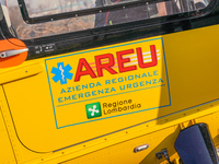 Logo AREU - Azienda Regionale Emergenza Urgenza printed on the side of medical helicopter, in Cernusco sul Naviglio, Italy, on February 10,...