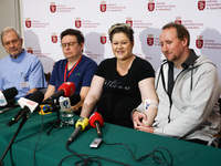 Dominika Clarke and Vince Clarke, the parents of the quintuplets are seen with doctors during a press conference at the University Hospital....