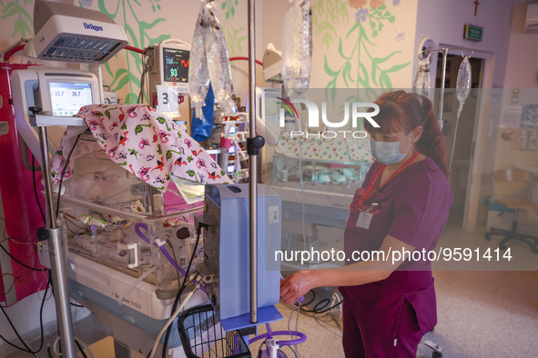 A nurse is taking care of the quintuplets laying in an incubator. Krakow, Poland on February 14, 2023. Three girls and two boys were born in...