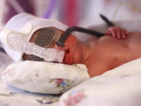 One of the quintuplets, which were born in the University Hospital, is seen in an incubator. Krakow, Poland on February 14, 2023. Three girl...