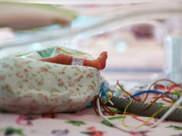 A tiny leg of one of the quintuplets, which were born in the University Hospital, is seen in an incubator. Krakow, Poland on February 14, 20...