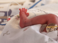 A tiny leg of one of the quintuplets, which were born in the University Hospital, is seen in an incubator. Krakow, Poland on February 14, 20...