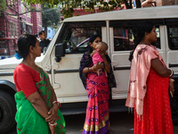 A woman playing with a toddler and waiting for treatment at a government-run hospital amid the spread of Adenovirus In Kolkata, India on 27...