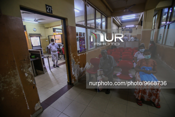 Worker walks through a deserted National Hospital Colombo as health workers hold a work strike in Colombo on March 01, 2022. Number of trade...