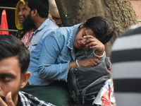 A woman mourns after her child died due to To Respiratory Infections with Adenovirus symptoms outside a Hospital in Kolkata, India on 1 Marc...