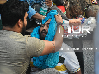 A person is consoled after his child died due to To Respiratory Infections with Adenovirus symptoms outside a Hospital in Kolkata, India on...