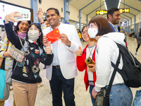 A Chinese tourist takes a selfie with the minister of tourism and lands, Harin Fernando, on March 1, 2023, in Katunayake, Sri Lanka. A Sri L...