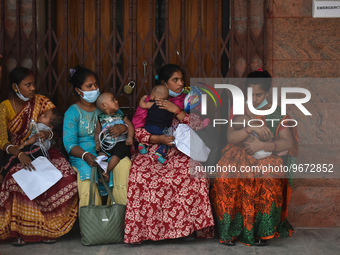 Patients and their relatives wait for treatment at a outside a Emergency ward  in government-run hospital for suffering from fever and respi...