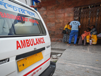 Patients and their relatives wait for treatment for suffering from fever and respiratory problems In outside an Emergency ward in a governme...