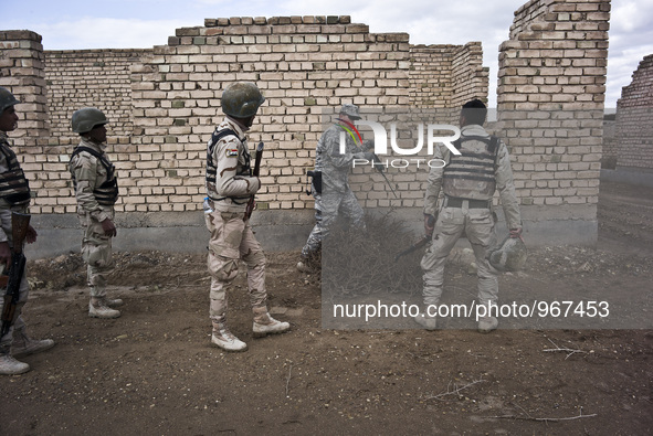 American military training with Iraqi soldiers during an exercise on approaching and clearing buildings in Baghdad, on January 8, 2015. The...