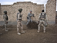 American military training with Iraqi soldiers during an exercise on approaching and clearing buildings in Baghdad, on January 8, 2015. The...