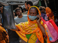 A woman looks at an x-ray of her seven-year-old granddaughter, who is suffering from fever and cough, at a hospital in Kolkata, on March 02,...