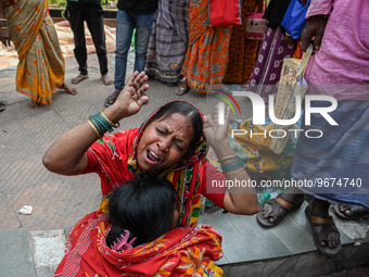 A woman reacts as the health condition of her eight-month-old grandson fluctuates, at a hospital in Kolkata, on March 02, 2023. Her grandson...