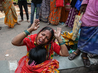 A woman reacts as the health condition of her eight-month-old grandson fluctuates, at a hospital in Kolkata, on March 02, 2023. Her grandson...