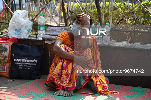 A woman reacts as the health condition of her three-year-old daughter fluctuates, at a hospital in Kolkata, on March 02, 2023. Her daughter,...