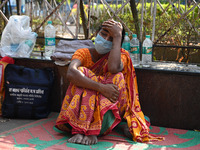 A woman reacts as the health condition of her three-year-old daughter fluctuates, at a hospital in Kolkata, on March 02, 2023. Her daughter,...