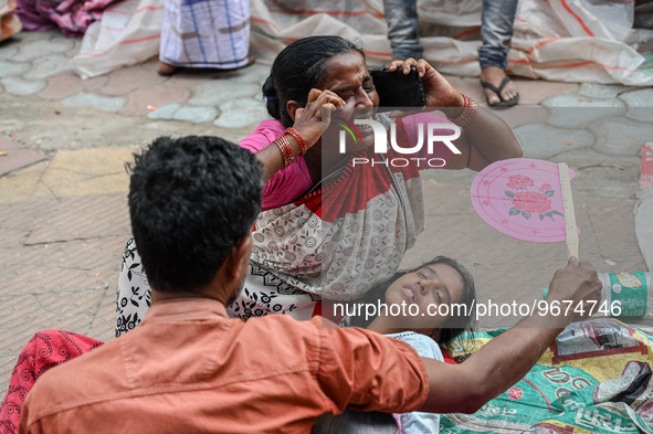 A woman reacts to the death of her three-month-old granddaughter who was undergoing treatment for respiratory problems, at a hospital in Kol...