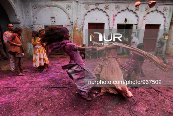 Indian Kids with colored powder on their face join celebrations of the Holi festival at the Pagal Baba Ashram in Vrindavan on March 3 , 2015...