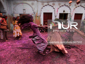 Indian Kids with colored powder on their face join celebrations of the Holi festival at the Pagal Baba Ashram in Vrindavan on March 3 , 2015...