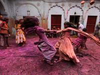 Indian Kids with colored powder on their face join celebrations of the Holi festival at the Pagal Baba Ashram in Vrindavan on March 3 , 2015...