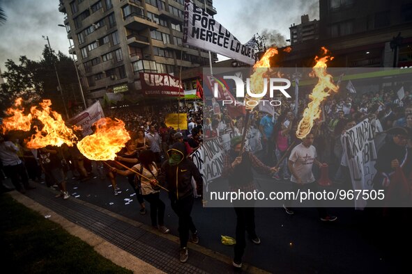 People take part in a march called ''For a March 8 without clandestine abortions'' to commemorate the International Women's Day, in Santiago...