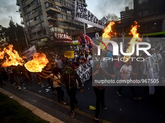 People take part in a march called ''For a March 8 without clandestine abortions'' to commemorate the International Women's Day, in Santiago...