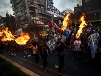 People take part in a march called ''For a March 8 without clandestine abortions'' to commemorate the International Women's Day, in Santiago...