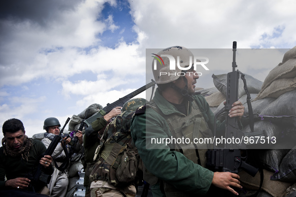 Members of the Kurdish Peshmerga forces, PKK and YPG fighting for retaking the Sinjar City from ISIS, on March 23, 2015. 